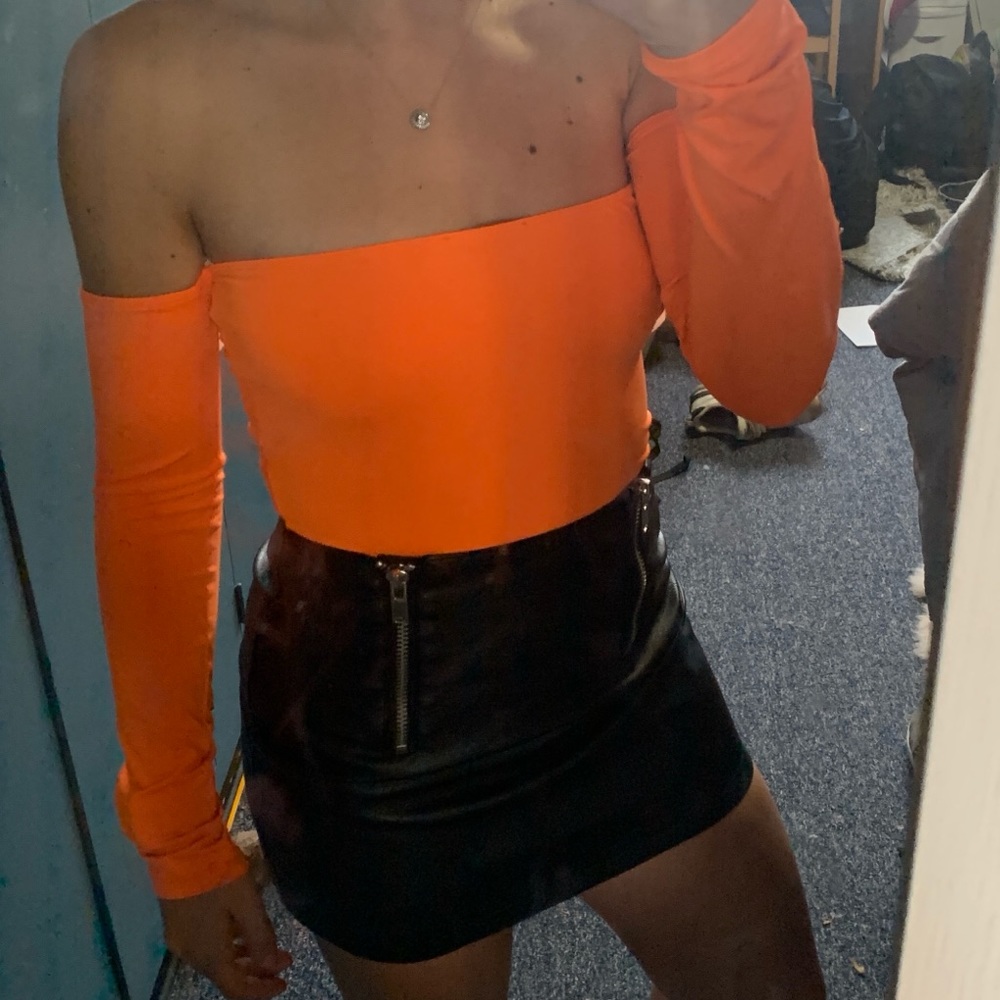 Neon orange body suit